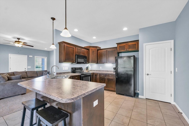 kitchen with black appliances, a sink, open floor plan, light tile patterned flooring, and ceiling fan