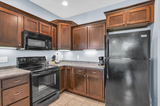 kitchen with black appliances, light tile patterned flooring, and recessed lighting