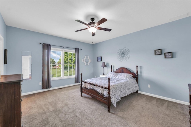bedroom featuring carpet flooring, baseboards, and ceiling fan