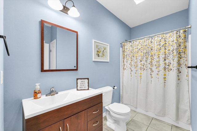bathroom featuring tile patterned floors, toilet, and vanity