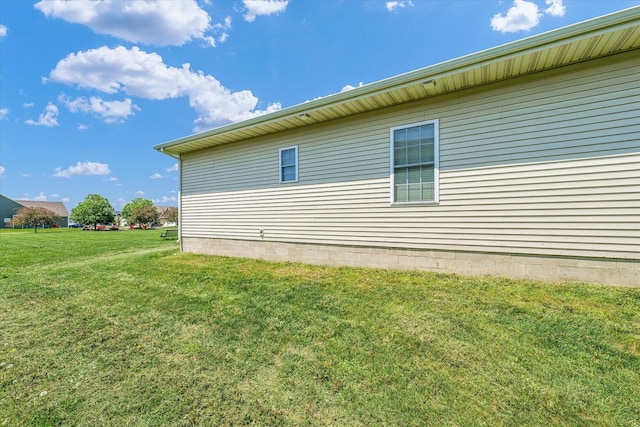 view of side of home featuring a yard
