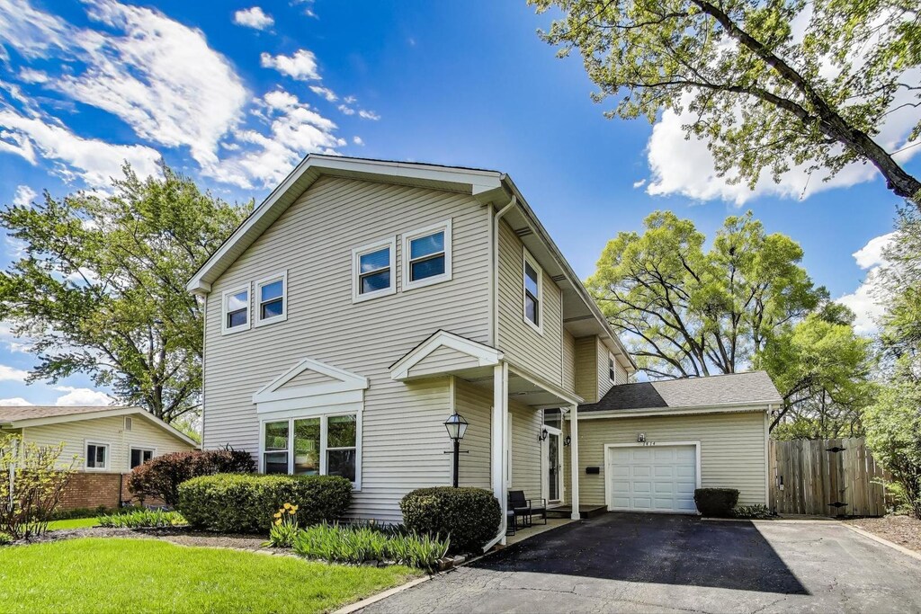 1414 N Illinois Ave, Arlington Heights, IL 60004 - view of front of house featuring fence, asphalt driveway, and an attached garage
