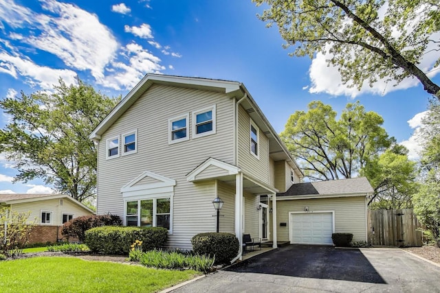 1414 N Illinois Ave, Arlington Heights, IL 60004 - view of front of house featuring fence, asphalt driveway, and an attached garage
