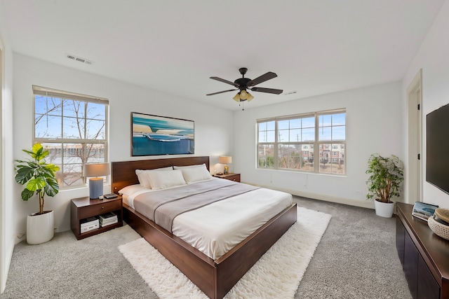 carpeted bedroom with a ceiling fan