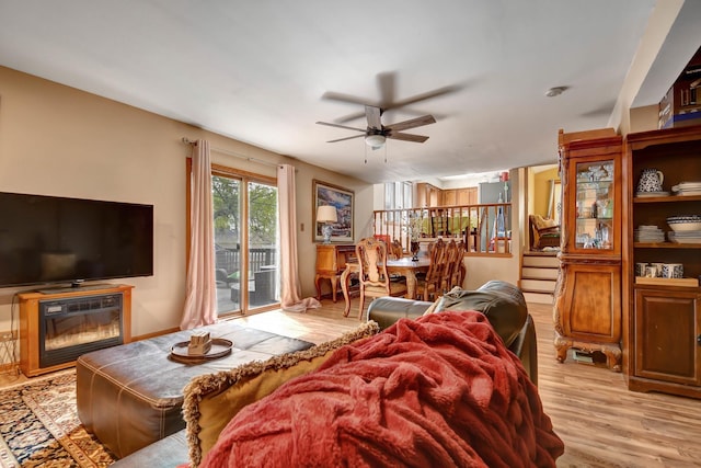 6732 W 113th Pl, Worth, IL 60482 - living area featuring ceiling fan, light wood-style flooring, and a glass covered fireplace