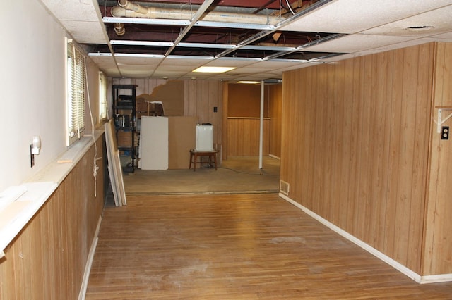basement with wood finished floors and wood walls