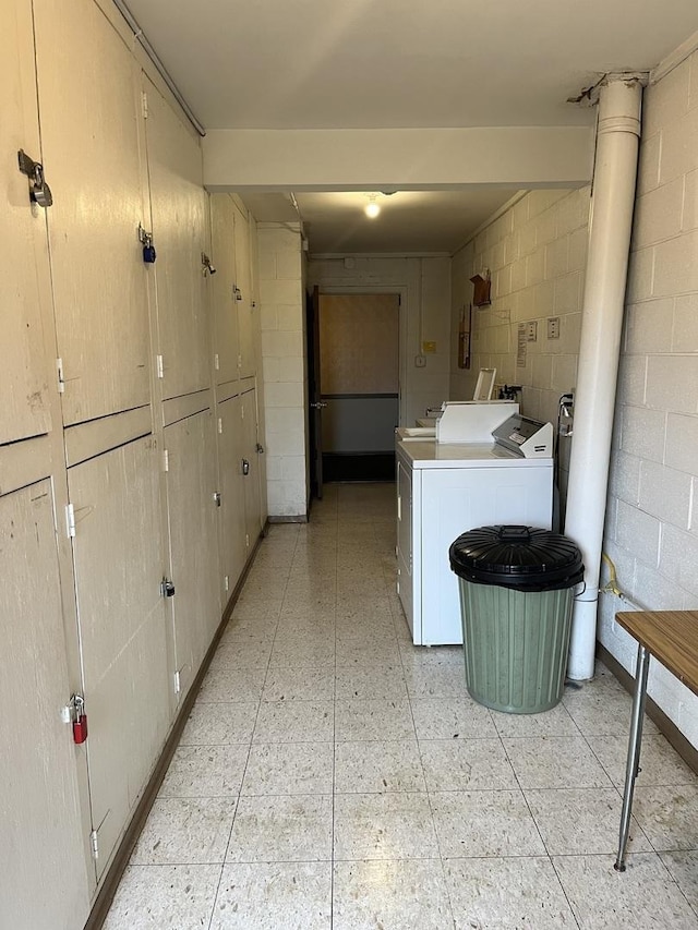 3237 S Manor Dr Unit 310, Lansing, IL 60438 - washroom featuring cabinet space, washer and dryer, concrete block wall, and electric panel