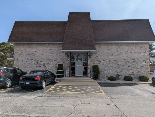 3237 S Manor Dr Unit 310, Lansing, IL 60438 - view of property featuring uncovered parking