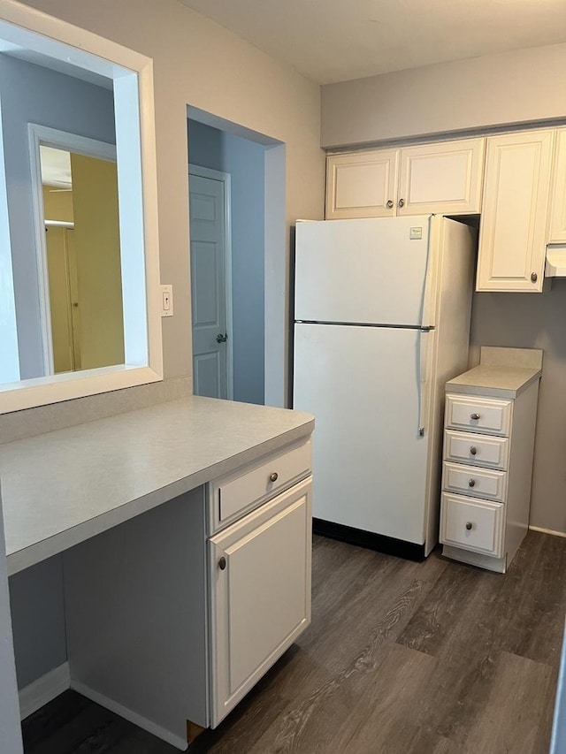 3237 S Manor Dr Unit 310, Lansing, IL 60438 - kitchen with freestanding refrigerator, dark wood-type flooring, light countertops, and white cabinets