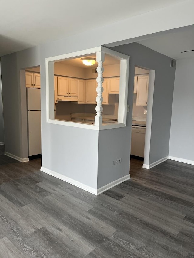 3237 S Manor Dr Unit 310, Lansing, IL 60438 - kitchen featuring white appliances, under cabinet range hood, dark wood finished floors, and baseboards