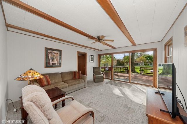 carpeted living room with a ceiling fan