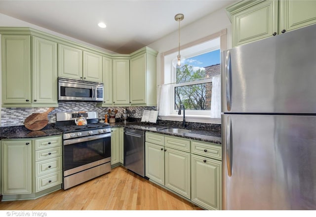 1018 Main St Unit 3, Evanston, IL 60202 - kitchen with appliances with stainless steel finishes, a sink, and green cabinets
