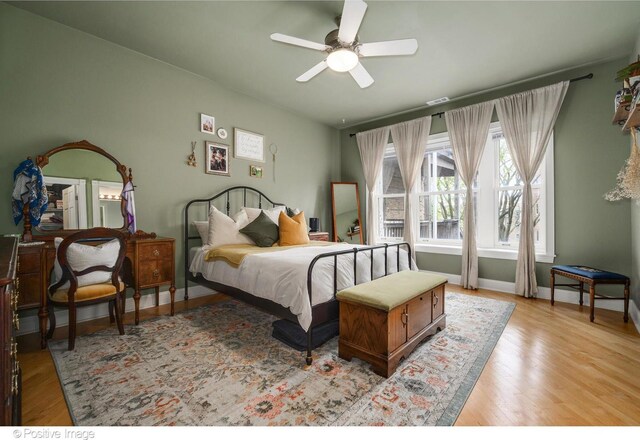 1018 Main St Unit 3, Evanston, IL 60202 - bedroom with light wood-style floors, baseboards, and a ceiling fan