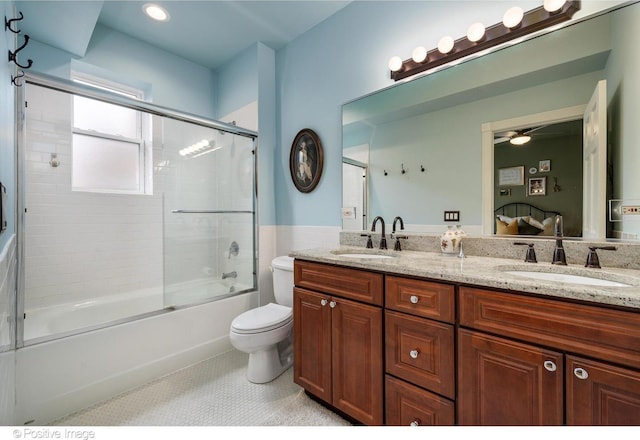 1018 Main St Unit 3, Evanston, IL 60202 - bathroom with toilet, double vanity, enclosed tub / shower combo, a wainscoted wall, and a ceiling fan