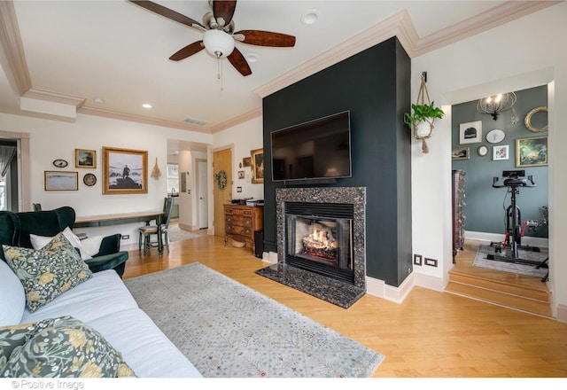1018 Main St Unit 3, Evanston, IL 60202 - living room featuring a ceiling fan, ornamental molding, a fireplace with flush hearth, wood finished floors, and recessed lighting