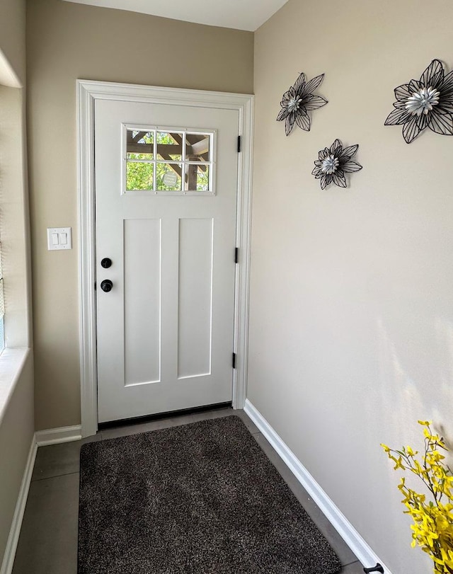 entryway featuring baseboards