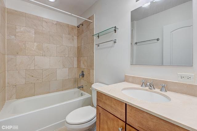 full bath featuring toilet, vanity, and tub / shower combination