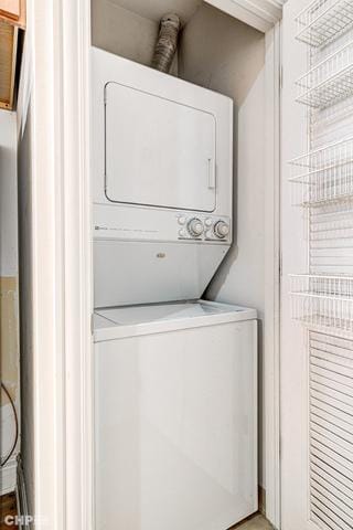 laundry room with estacked washer and dryer