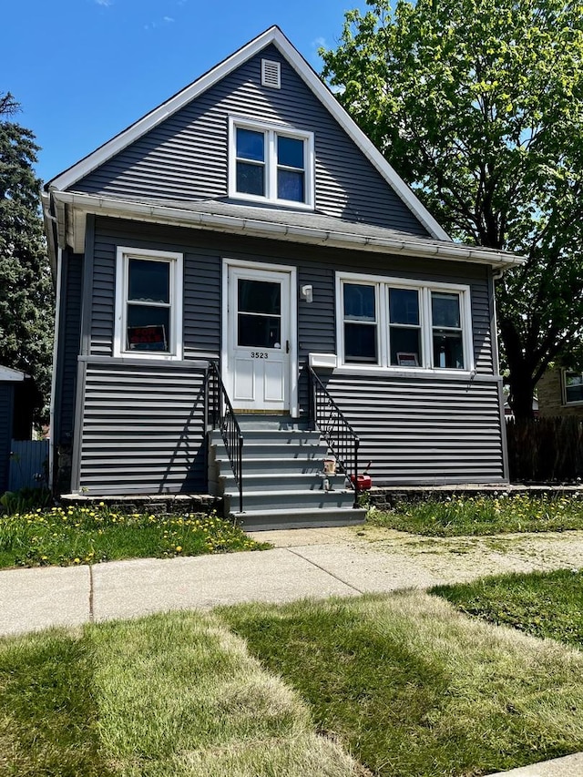 bungalow-style home with entry steps