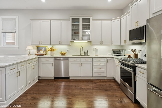 1319 N Oakley Blvd, Chicago, IL 60622 - kitchen featuring stainless steel appliances, a sink, recessed lighting, white cabinets, and a peninsula