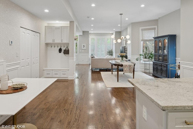 1319 N Oakley Blvd, Chicago, IL 60622 - kitchen featuring a decorative wall, dark wood-style floors, wainscoting, light stone counters, and recessed lighting