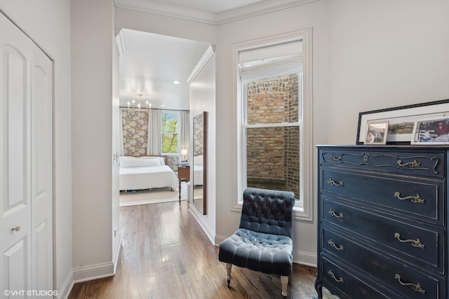 1319 N Oakley Blvd, Chicago, IL 60622 - sitting room featuring baseboards, wood finished floors, a chandelier, and crown molding