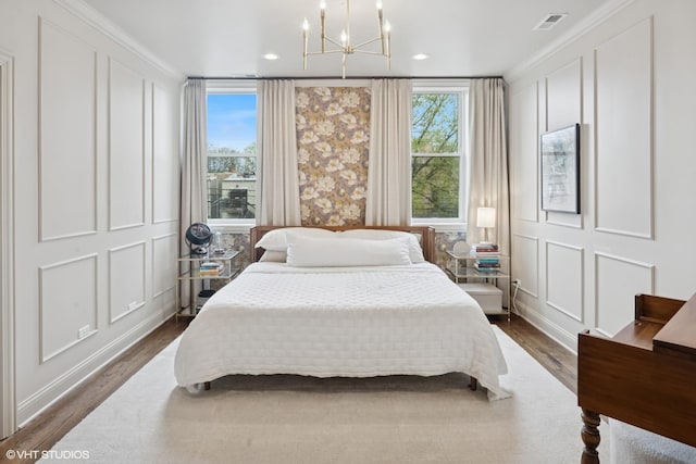 1319 N Oakley Blvd, Chicago, IL 60622 - bedroom featuring a decorative wall, multiple windows, a chandelier, dark wood-style floors, and recessed lighting