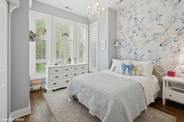 1319 N Oakley Blvd, Chicago, IL 60622 - bedroom with wood finished floors, a chandelier, multiple windows, and baseboards