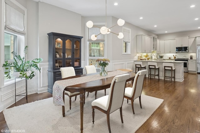 1319 N Oakley Blvd, Chicago, IL 60622 - dining room with healthy amount of natural light, a decorative wall, recessed lighting, dark wood finished floors, and wainscoting