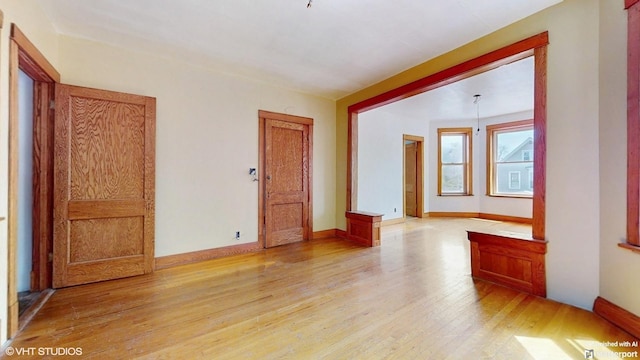 3072 N Haussen Ct, Chicago, IL 60618 - empty room with light wood-style flooring and baseboards
