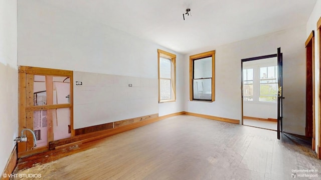3072 N Haussen Ct, Chicago, IL 60618 - unfurnished room featuring wood finished floors and baseboards
