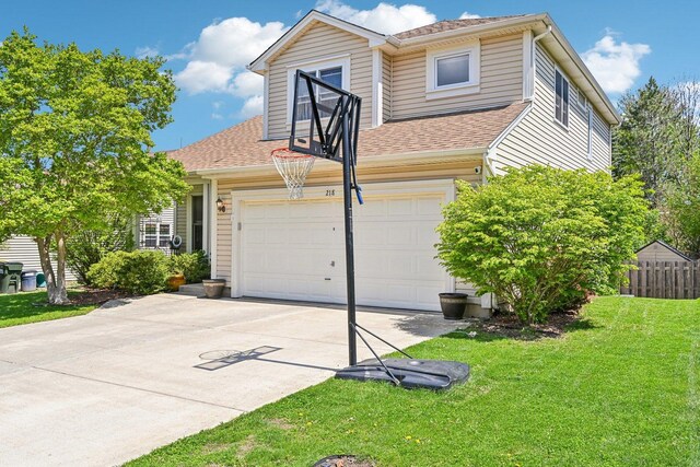 view of side of home featuring concrete driveway, a shingled roof, and a garage