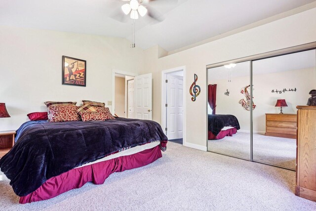 bedroom with carpet, vaulted ceiling, a closet, ceiling fan, and baseboards