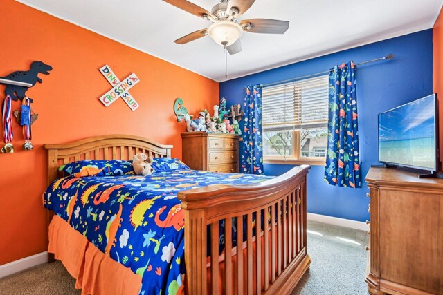 bedroom featuring carpet, baseboards, and ceiling fan