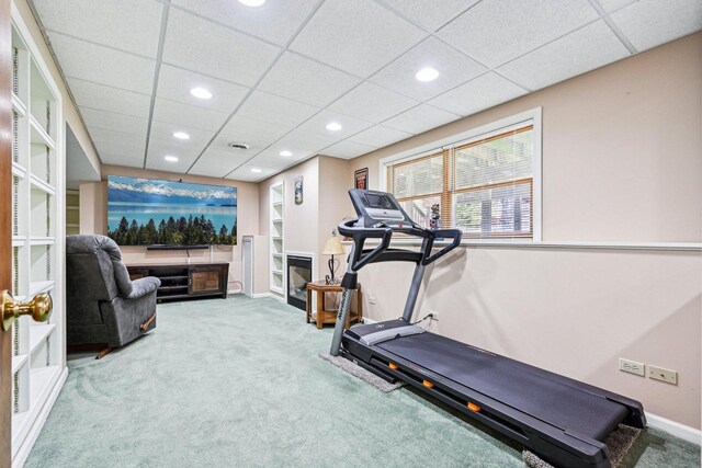 exercise room featuring carpet floors, recessed lighting, and a drop ceiling