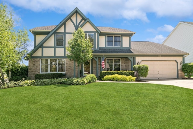 1593 Surridge Ct, Mundelein, IL 60060 - english style home featuring brick siding, an attached garage, driveway, and a front lawn