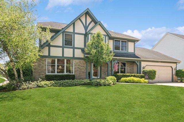 1593 Surridge Ct, Mundelein, IL 60060 - tudor-style house with brick siding, an attached garage, a front lawn, and stucco siding