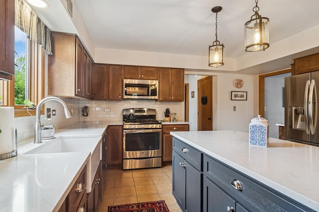 1593 Surridge Ct, Mundelein, IL 60060 - kitchen with appliances with stainless steel finishes, tasteful backsplash, a sink, and pendant lighting