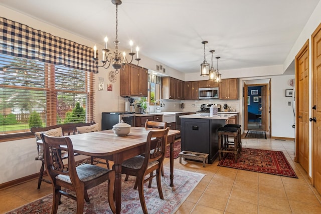 1593 Surridge Ct, Mundelein, IL 60060 - dining area with a chandelier, light tile patterned floors, and baseboards