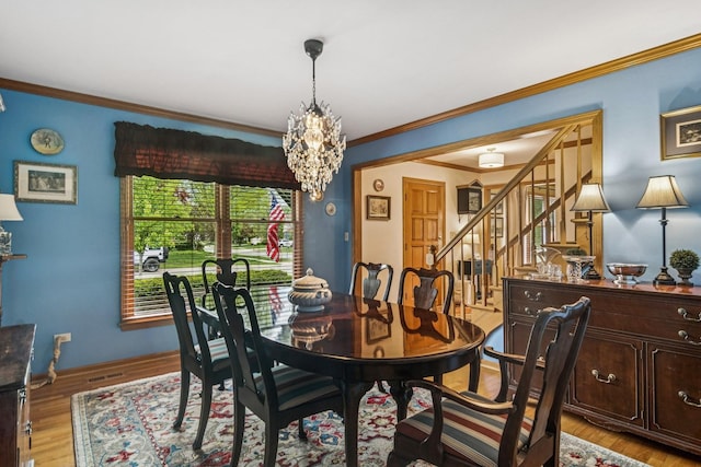 1593 Surridge Ct, Mundelein, IL 60060 - dining space featuring stairs, ornamental molding, a chandelier, and light wood finished floors
