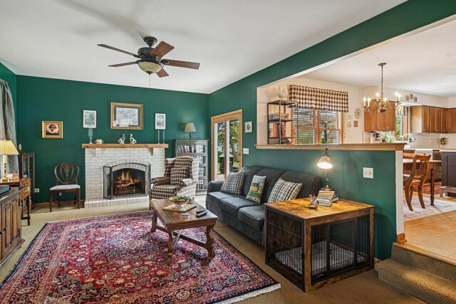 1593 Surridge Ct, Mundelein, IL 60060 - living area featuring ceiling fan, a fireplace, a chandelier, and light carpet