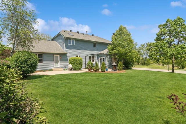 1593 Surridge Ct, Mundelein, IL 60060 - rear view of house with a patio area, a yard, a shingled roof, and entry steps