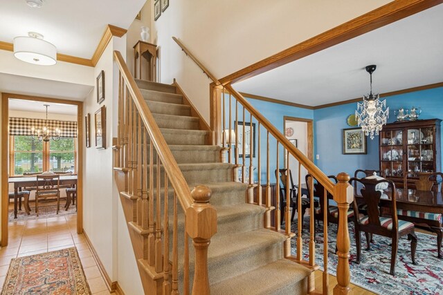 1593 Surridge Ct, Mundelein, IL 60060 - staircase with a chandelier, crown molding, tile patterned floors, and baseboards