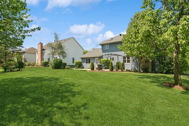 1593 Surridge Ct, Mundelein, IL 60060 - view of grassy yard featuring a patio