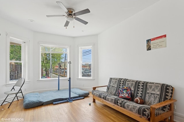 2416 N Avers Ave, Chicago, IL 60647 - exercise room featuring wood finished floors, baseboards, and a ceiling fan