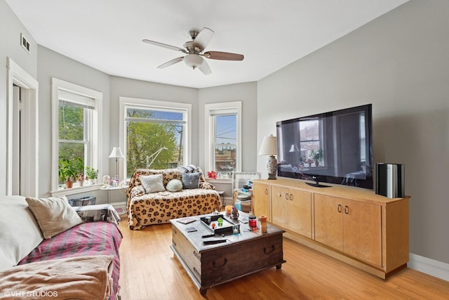 2416 N Avers Ave, Chicago, IL 60647 - living room with light wood-style floors, a ceiling fan, and baseboards