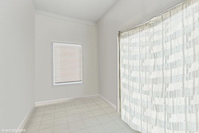 2416 N Avers Ave, Chicago, IL 60647 - spare room featuring light tile patterned floors and baseboards