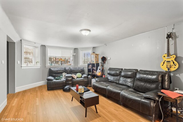 2416 N Avers Ave, Chicago, IL 60647 - living area featuring plenty of natural light, light wood-style floors, and baseboards
