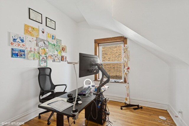 2416 N Avers Ave, Chicago, IL 60647 - home office with vaulted ceiling, wood finished floors, and baseboards