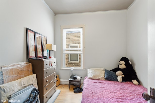 2416 N Avers Ave, Chicago, IL 60647 - bedroom with light wood finished floors and crown molding